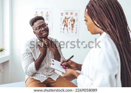 African american mid adult man with eyes closed touching painful throat against white background. copy space, throat, thyroid, medical, pain, sickness and healthcare concept. 