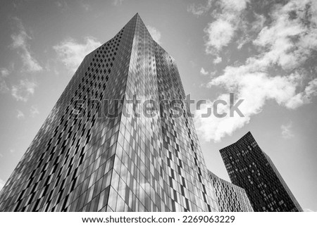 A black and white image of the dominating skyscrapers of the Deansgate Square apartment complex pictured in Manchester in February 2023.