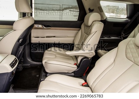 Second row captain’s chairs of the modern SUV car inside. Leather back passenger seats in modern luxury car. Comfortable leather seats. Royalty-Free Stock Photo #2269065783