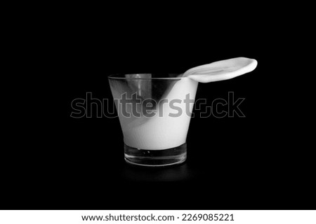 Splashes of milk on a black background.
