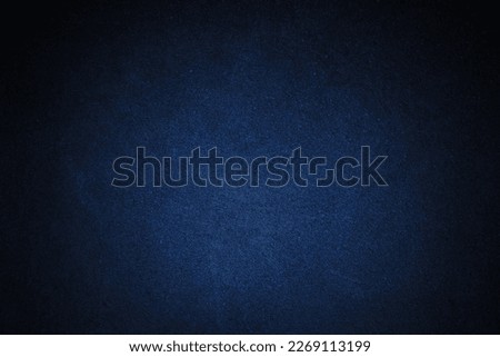 Black navy blue texture background with space for design. Dark rough concrete wall surface. Close-up.