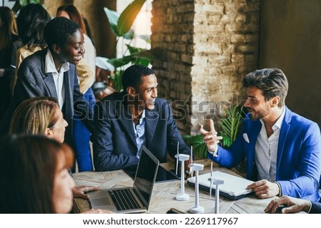 Multiracial business people working on sustainable innovation project - Focus on young african woman face Royalty-Free Stock Photo #2269117967