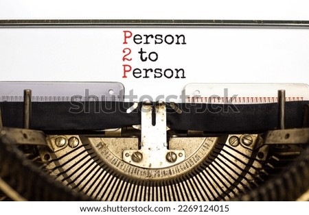 P2P person to persons symbol. Concept words P2P person to person typed on retro old typewriter on a beautiful white paper background. Business and P2P person to persons concept. Copy space.