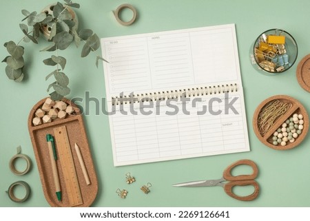 Mockup of  weekly planner and office stationery with copy space for text. Flat lay, top view photo mock up. Royalty-Free Stock Photo #2269126641