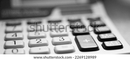 abstract financial legal lawyer business background with macro detail of office supplies and technology. defocused black and white horizontal photo