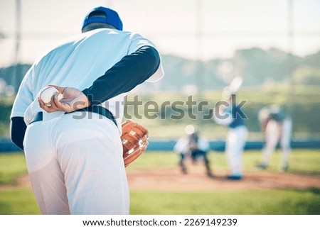 Man, baseball and pitcher ready to throw ball for game, match or victory shot on grass field at pitch. Male sports player with hand behind back with mitt in preparation for sport pitching outdoors