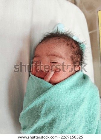 KUALA LUMPUR, MALAYSIA - 2nd March 2023: Pictures of a newborn baby boy.
