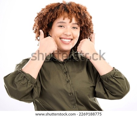 Thumbs up, black woman smile and portrait of young model in isolated white background in studio.Thank you, yes and like emoji hand sign of a female showing okay, agreement and approval hands gesture