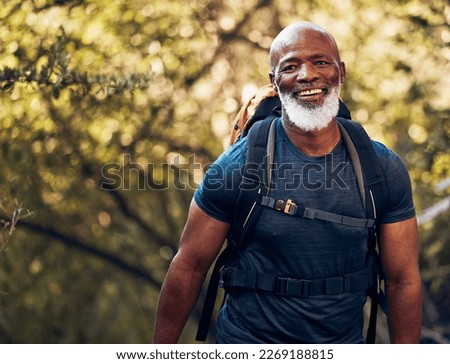 Happy, hiking and portrait of black man in forest for freedom, health and sports training. Exercise, peace and wellness with senior hiker trekking in nature for travel, summer break and adventure Royalty-Free Stock Photo #2269188815