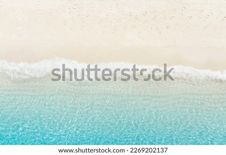 The tropical Summer with  Soft blue ocean wave on fine sandy beach  background