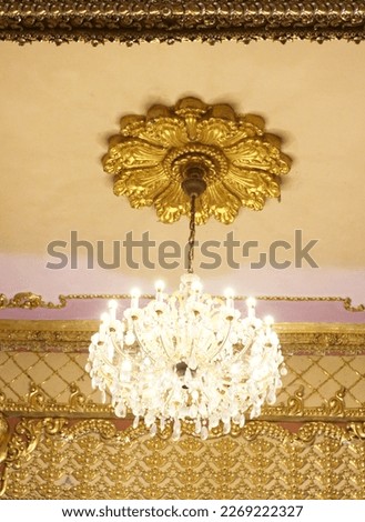 chandelier hangs from the ceiling