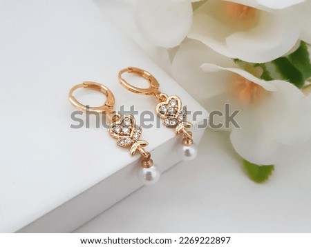 White Pearl Earrings with Cubic Zirconia on White Background Flower for Wedding Royalty-Free Stock Photo #2269222897