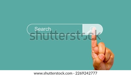 information search sign Human hand touching search bar for Search Engine Optimization or SEO to find information or information by internet connection, network, database, information system.