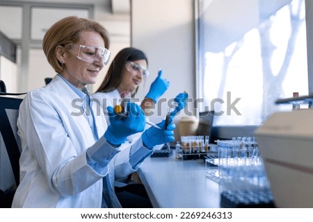 Modern Medical Research Laboratory: Female Scientist Working with Micro Pipette, Analysing Biochemicals Samples. Advanced Scientific Lab for Medicine, Microbiology Development. Royalty-Free Stock Photo #2269246313