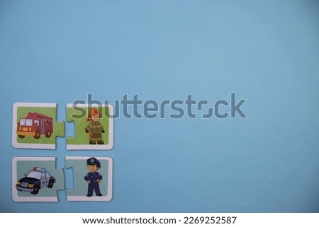 Educational puzzles with picture of fire engine, fire truck, police and police car placed on left over blue background.