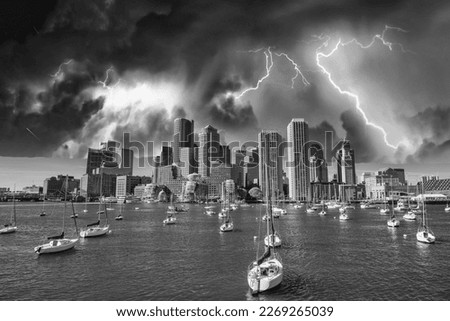 Boston Skyline and boats under a coming storm, Massachusetts.