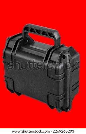 black carrying case, tool case isolated red background