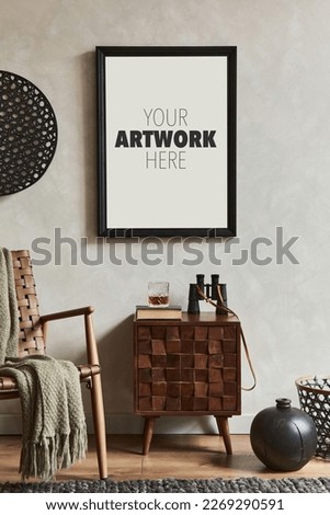 Creative composition of elegant masculine room interior with mock up poster frame, brown armchair, designed commode and personal accessories. Template.   Royalty-Free Stock Photo #2269290591