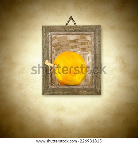 Pumpkin,a photo frame hanging on the wall with copy space for text