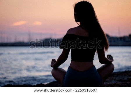 young woman practicing yoga, Sa Rapita beach, Campos, Mallorca, balearic islands, Spain