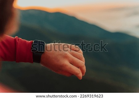 Man Using A Digital Smartwatch During Workout. Closeup View Of Man's Hands Checking An App In Smartwatch. Close-up Of A Clock That Shows Steps, Kilometers And bpm. Royalty-Free Stock Photo #2269319623