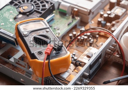 multimeter on CCTV DVR recorder case ,electrical work concept ,selective focus  Royalty-Free Stock Photo #2269329355