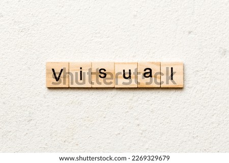 visual word written on wood block. visual text on table, concept.