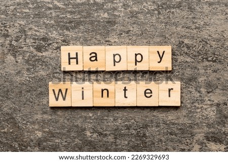 Happy winter word written on wood block. Happy winter text on cement table for your desing, concept.