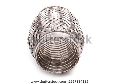 a part of a car muffler. corrugation. metal part. white background