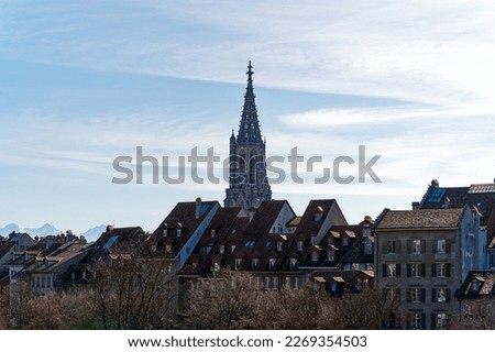 Scenic view of the old town of Swiss City of Bern with Minster Church seen from Grain Bridge on a sunny winter day. Photo taken February 21st, 2023, Bern, Switzerland.