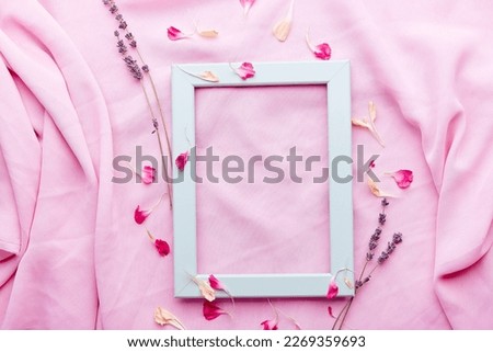 Aesthetic turquoise, blue empty interior pink wall layout, lavender and petals flat lay with copy space.