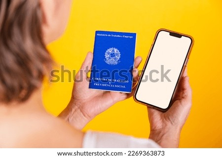 hand holding work and social security card, Brazilian document for formal work and smartphone with white screen