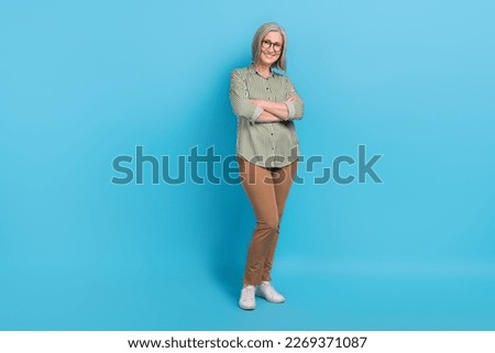 Full body size photo of cheerful positive attractive pensioner business owner company folded arms confident person isolated on blue color background