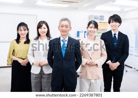 Group photo of members working in the office