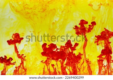 Abstract background picture with red paint dissolving in yellow water