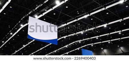 Roof structure and lighting in the exhibition hall or convention center with banner Royalty-Free Stock Photo #2269400403