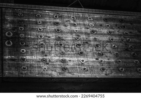 Detail of a beam with bolts, in an indoor swimming pool, in a sports centre.