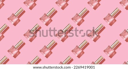 Perfume pattern. Perfume bottles on a pink background. Royalty-Free Stock Photo #2269419001