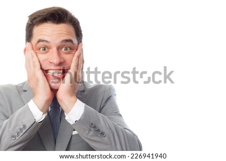 Young business man close up over white background. Looking funny