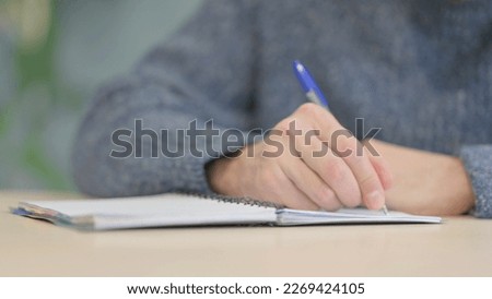 Close up of Man Writing a Letter