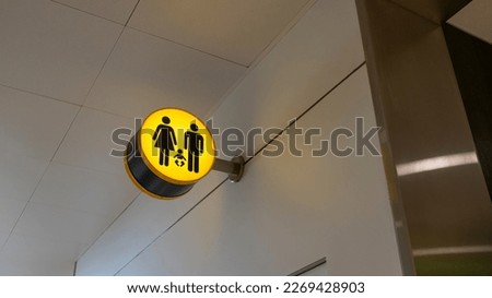 Family unisex restroom sign at airport