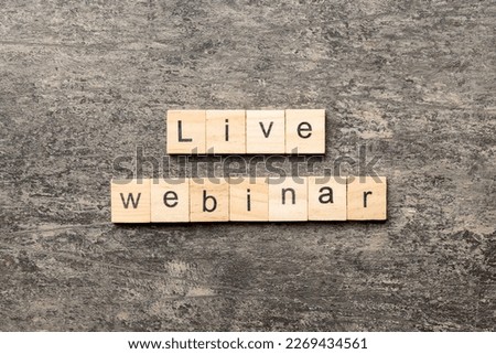 live webinar word written on wood block. live webinar text on cement table for your desing, concept.