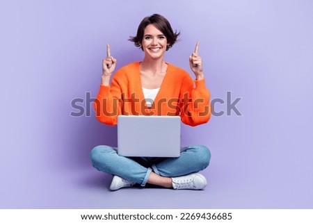 Full length photo cadre of optimistic programmer attractive girl indicate fingers up use laptop new app promo isolated on violet color background Royalty-Free Stock Photo #2269436685