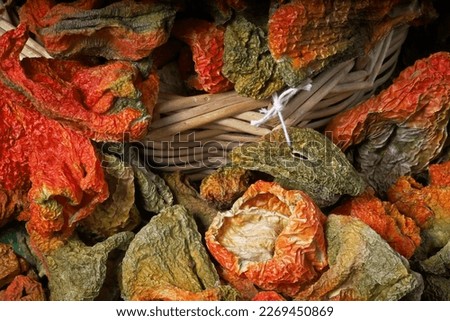 dried organic pepper in wicker basket
