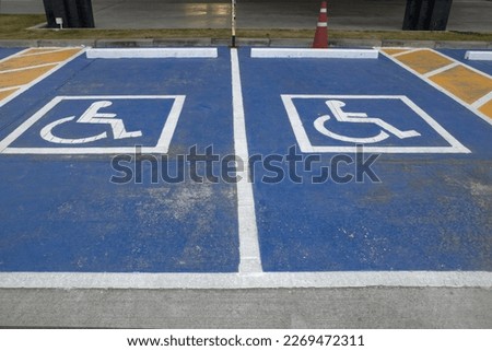 Disabled Parking.Disabled symbol on cement floor.
