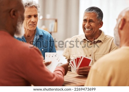 Senior man, friends and playing card games on wooden table in fun activity, social bonding or gathering. Group of elderly men having fun with cards for poker game enjoying play time together at home Royalty-Free Stock Photo #2269473699