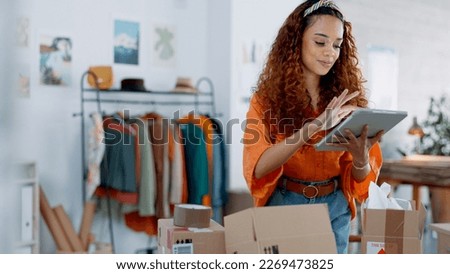 Tablet, logistics and fashion manager with a checklist in retail store clothes or clothing boxes inspection. Entrepreneur, shopping and small business owner writing stock delivery for quality control Royalty-Free Stock Photo #2269473825