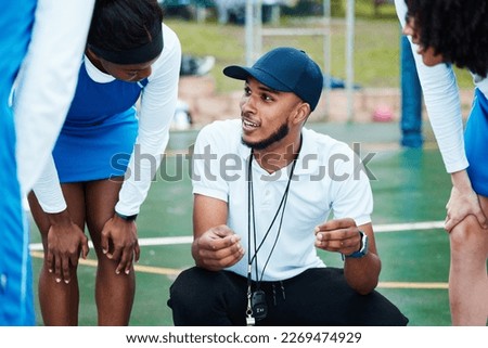 Coach, strategy and teamwork with sports people listening to tactics or instructions on a court. Fitness, team and planning with a black man talking to a group of girls during a competition Royalty-Free Stock Photo #2269474929