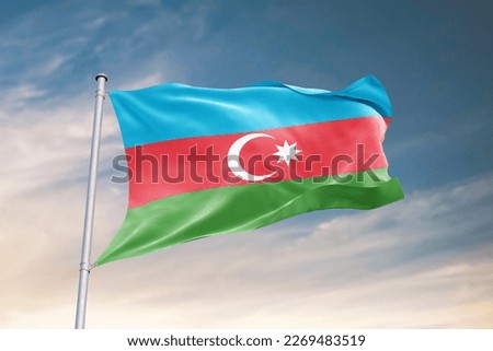 Waving flag of Azerbaijan in beautiful sky. Azerbaijan flag for independence day. The symbol of the state on wavy fabric. Royalty-Free Stock Photo #2269483519
