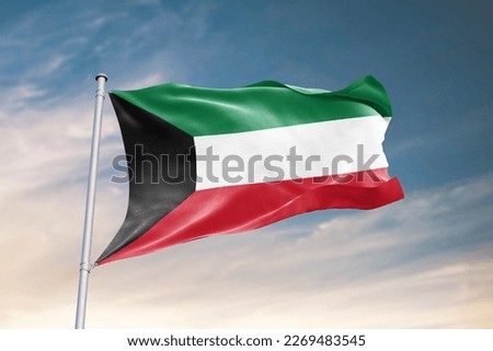 Waving flag of Kuwait in beautiful sky. Kuwait flag for independence day. The symbol of the state on wavy fabric. Royalty-Free Stock Photo #2269483545